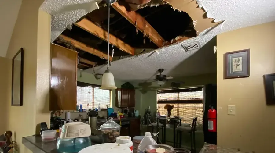 Ceiling drywall that collapsed above a kitchen after a water leak